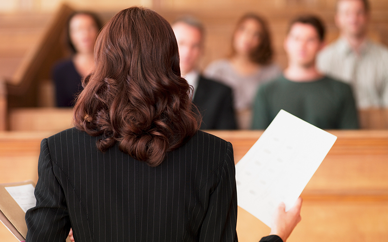 web Lawyer-holding-up-documents credit iStock-104821087.png - Credit: web Lawyer-holding-up-documents credit iStock-104821087.png